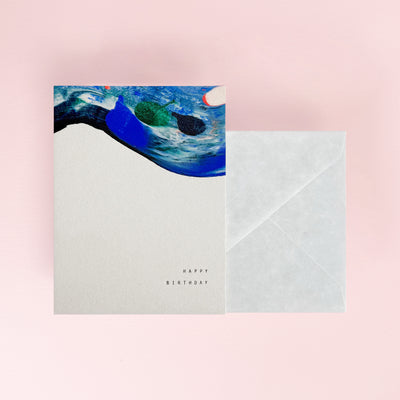 Greeting card with abstract design and envelope on a pink background