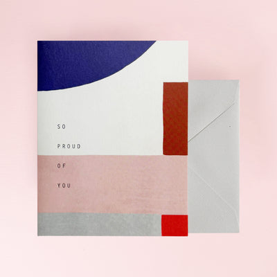 Greeting card with 'So proud of you' text and a grey envelope