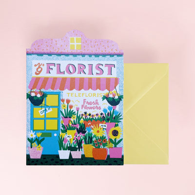Floral-themed greeting card with 'The Florist' design on a pink background