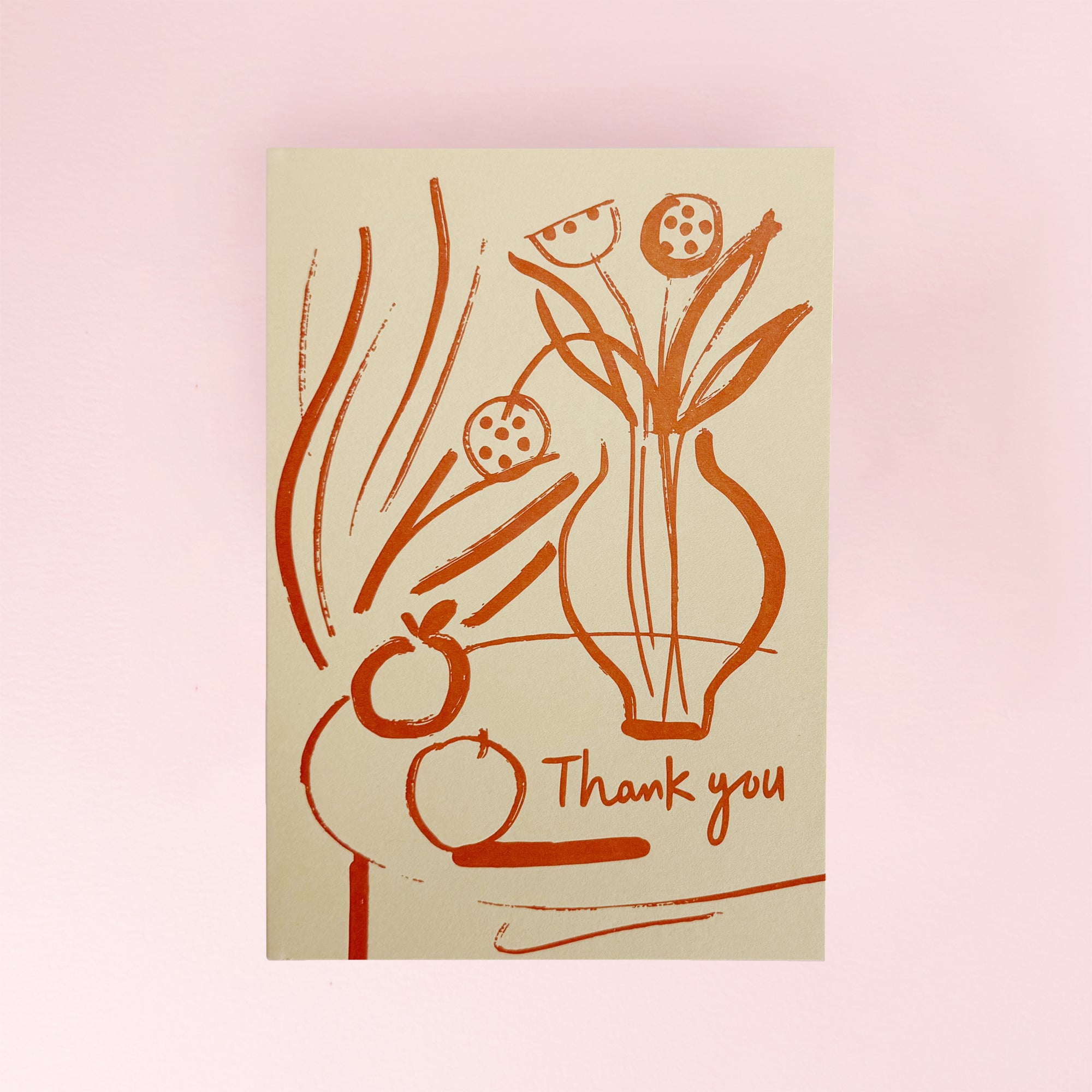 Card with floral design and 'Thank you' text on a beige background