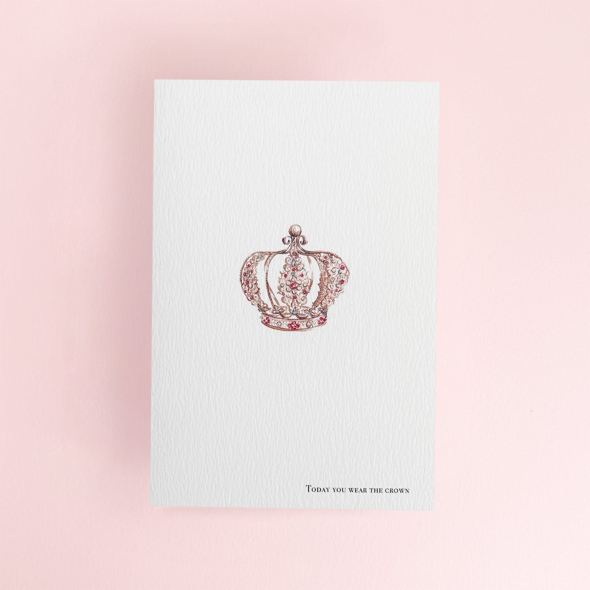 Card with a decorative crown design with 'today you wear the crown' written at the bottom of the greeting card