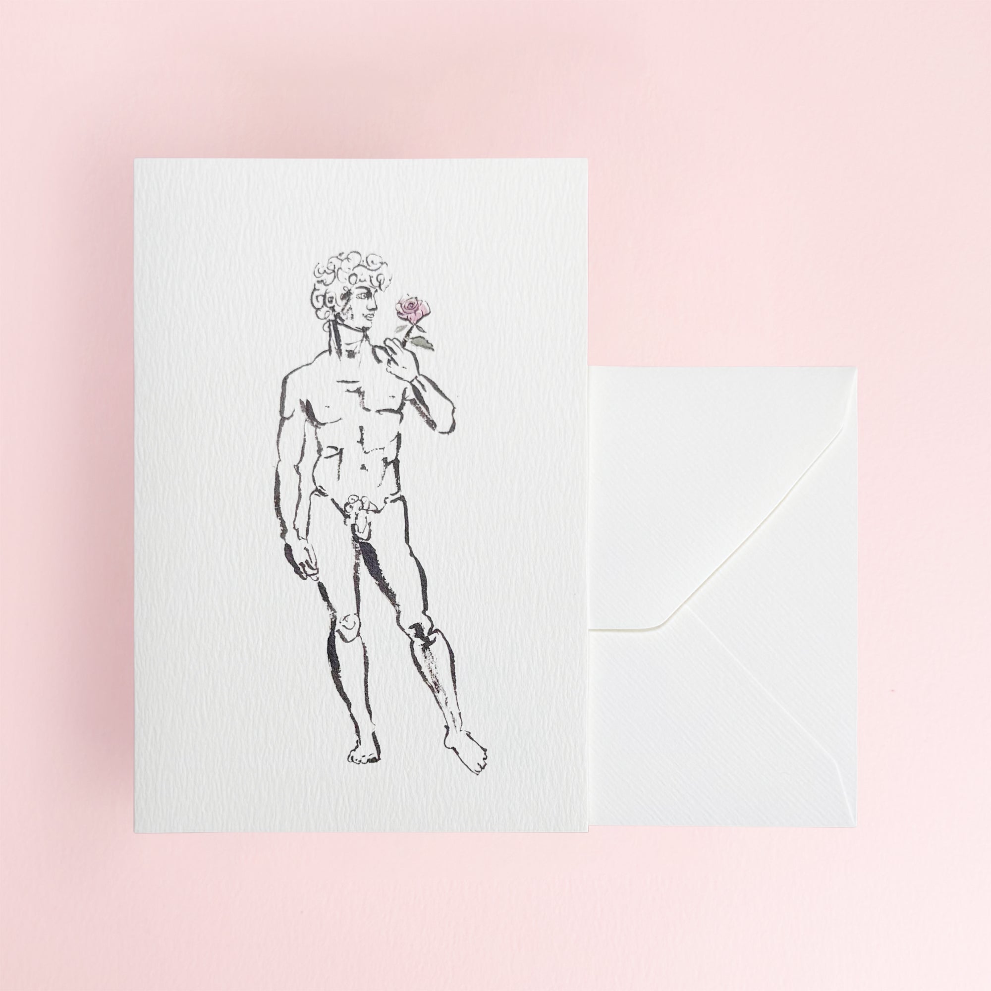 David holding a rose on a white greeting card