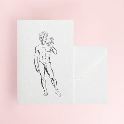 David holding a rose on a white greeting card