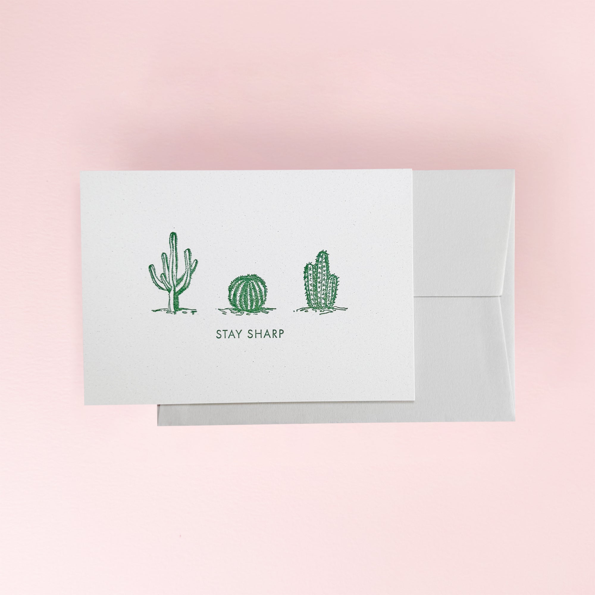 Greeting card with cactus illustrations and 'Stay Sharp' text
