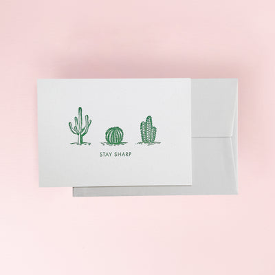 Greeting card with cactus illustrations and 'Stay Sharp' text
