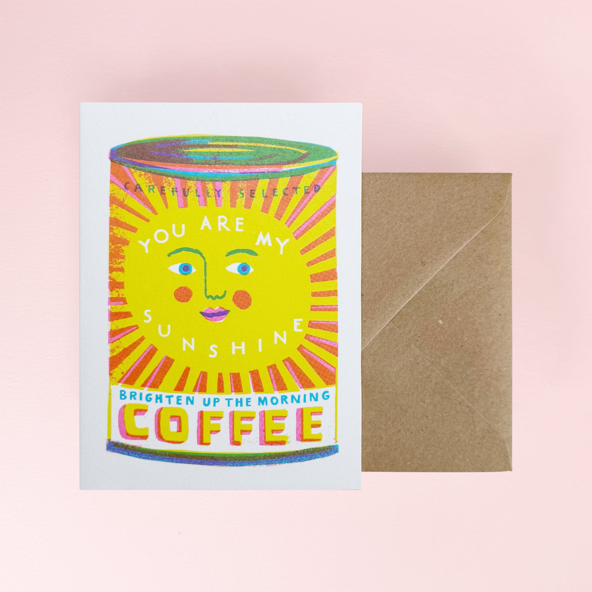 Card with coffee can design and envelope on a pink background