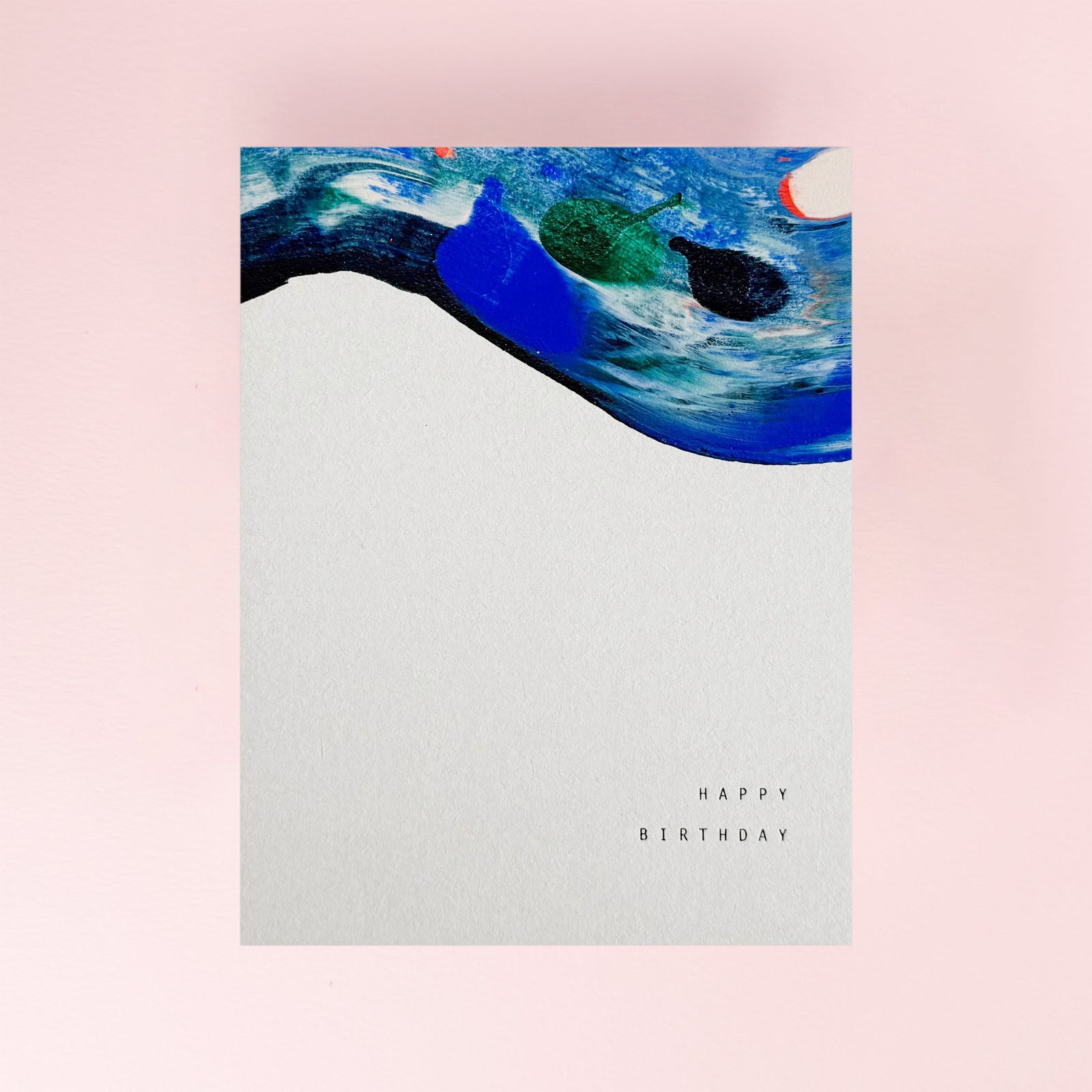 Greeting card with abstract design and 'Happy Birthday' text on a pink background