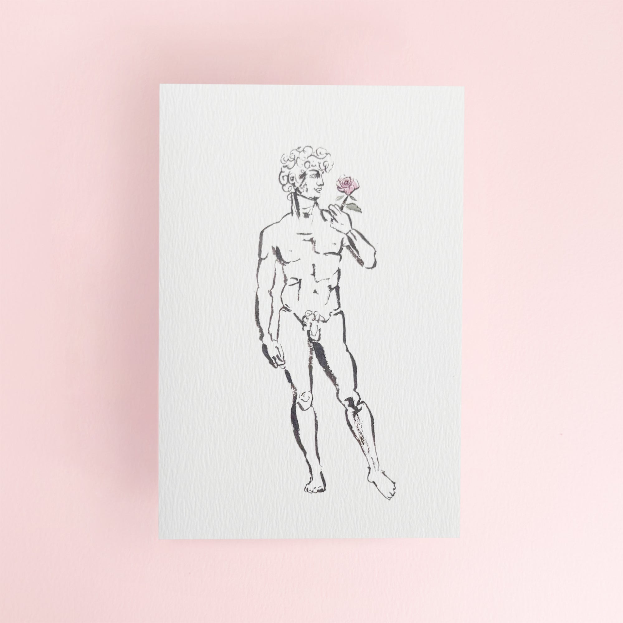 David holding a rose on a white greeting card