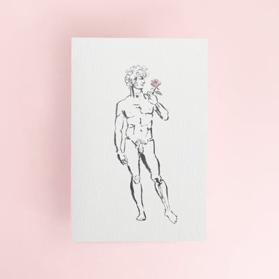 David holding a rose on a white greeting card