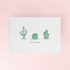 Three cactus illustrations on a white card with 'Stay Sharp' text on a greeting card
