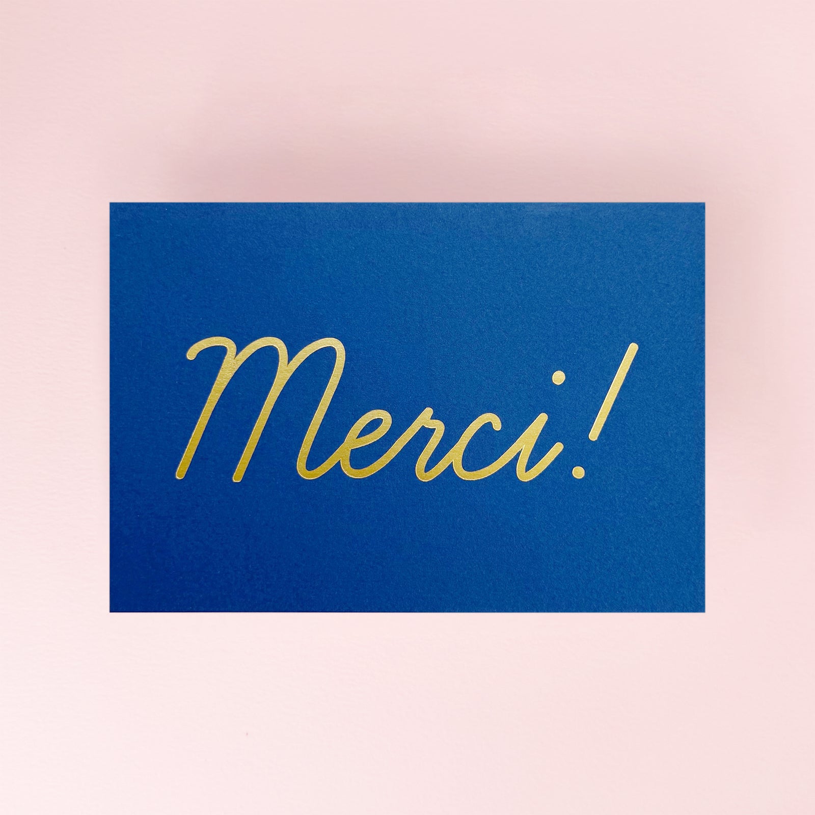 Yes_Merci_Card with a blue background and gold foiling