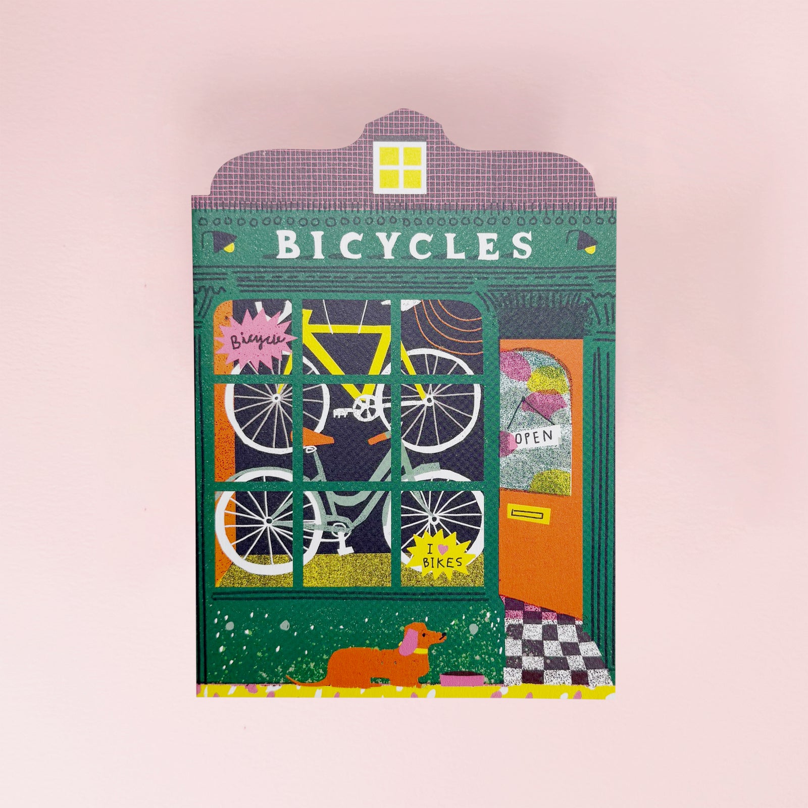 Greeting card with an Illustration of a bicycle shop with colorful design on a pink background